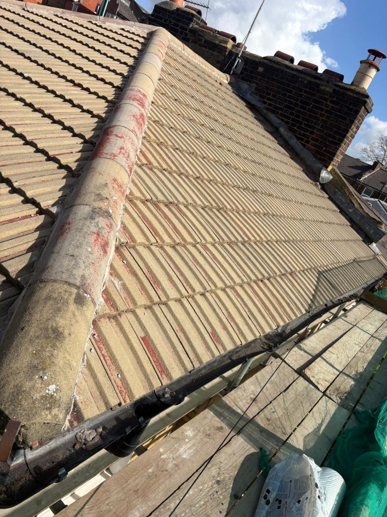 Existing tiled roof before replacement works by roofers in North London
