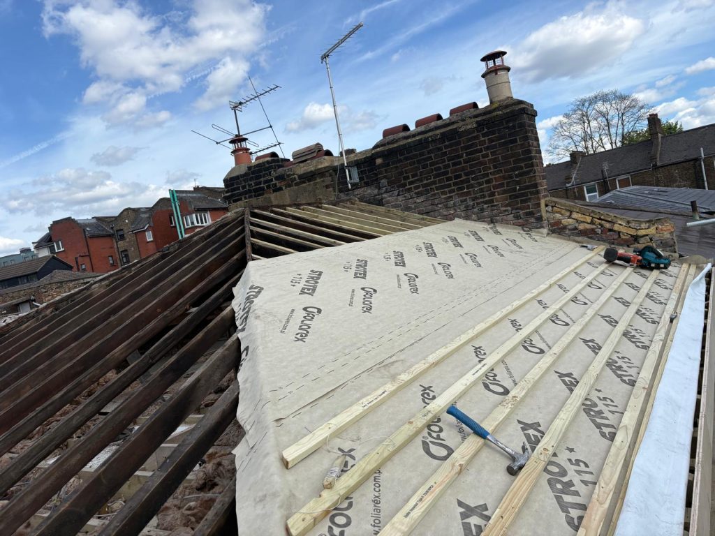 Roof structure preparation and breathable membrane installation by roofers in North London