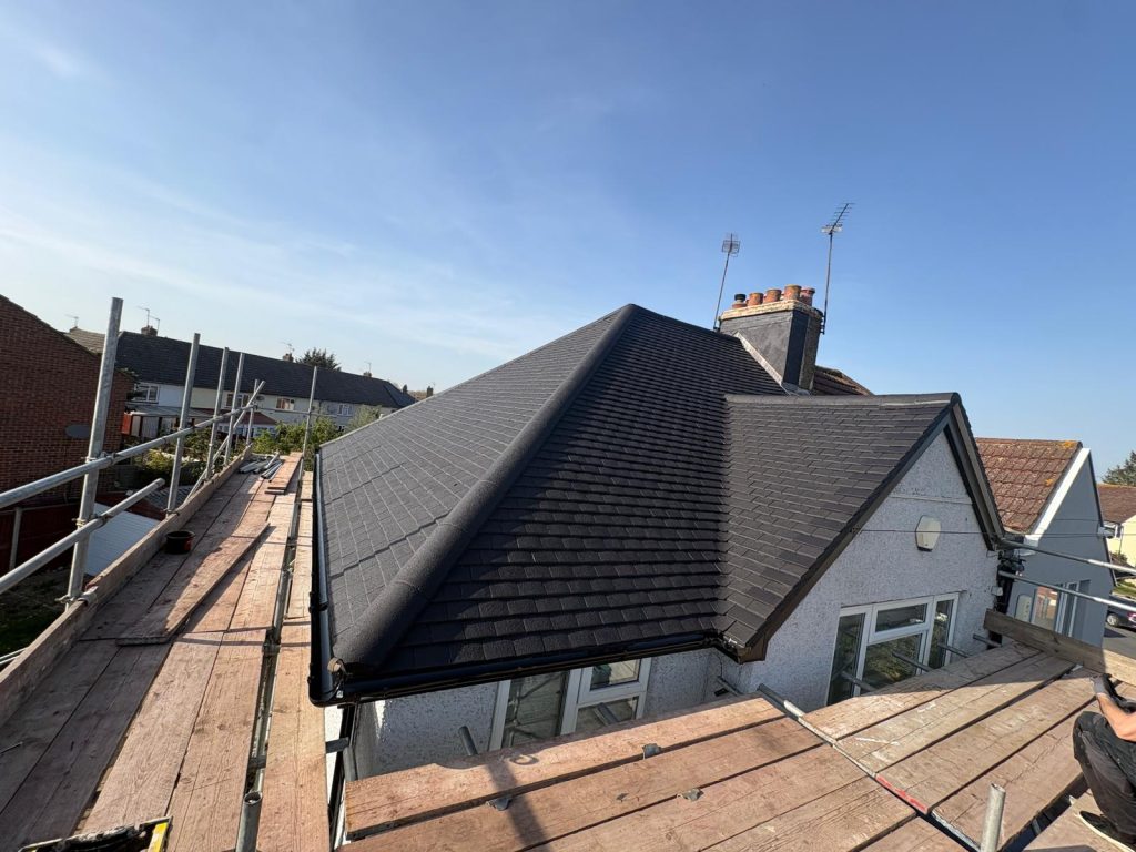 Completed roof cleaning and black roof coating project in North London